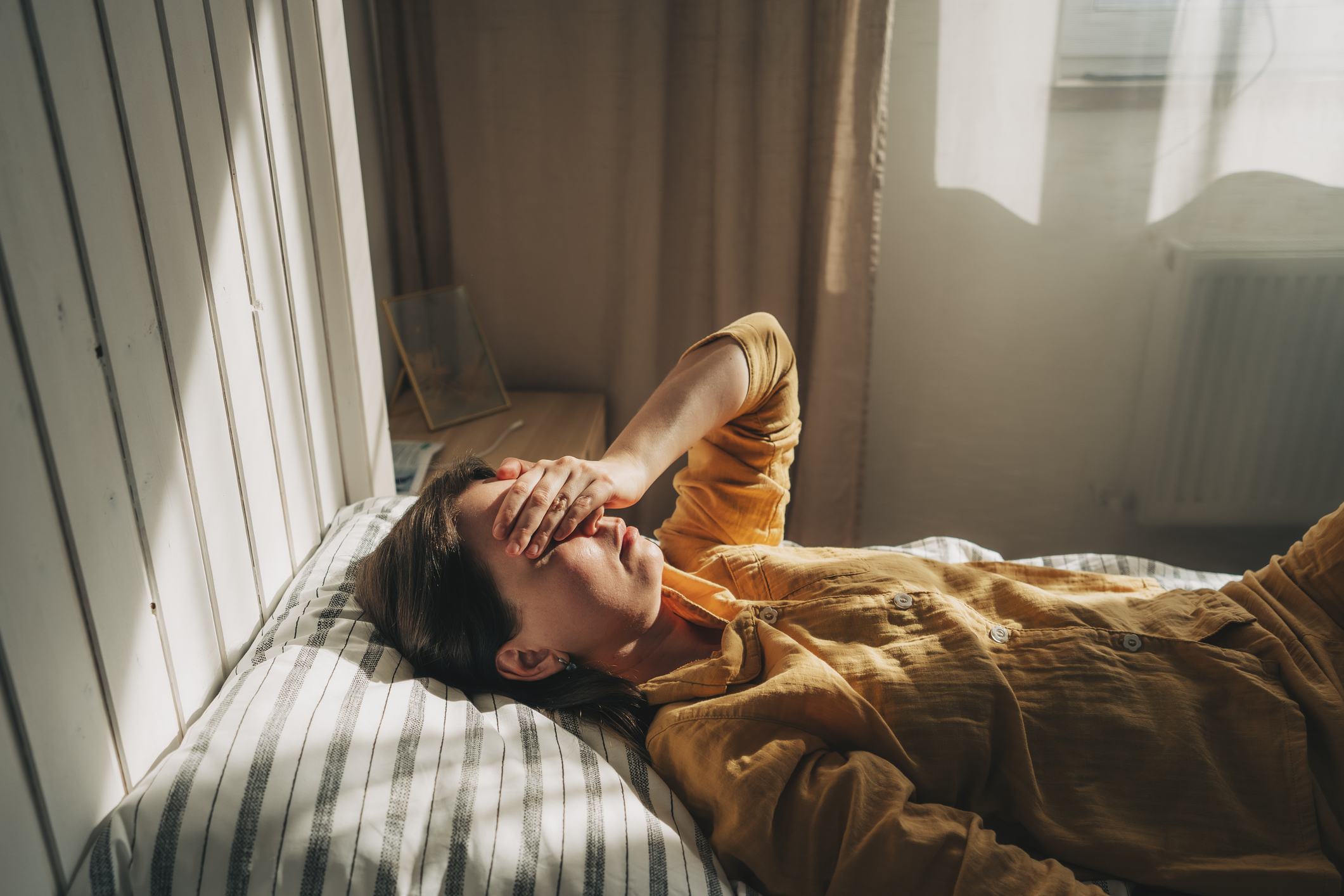 Person in bed lying down.
